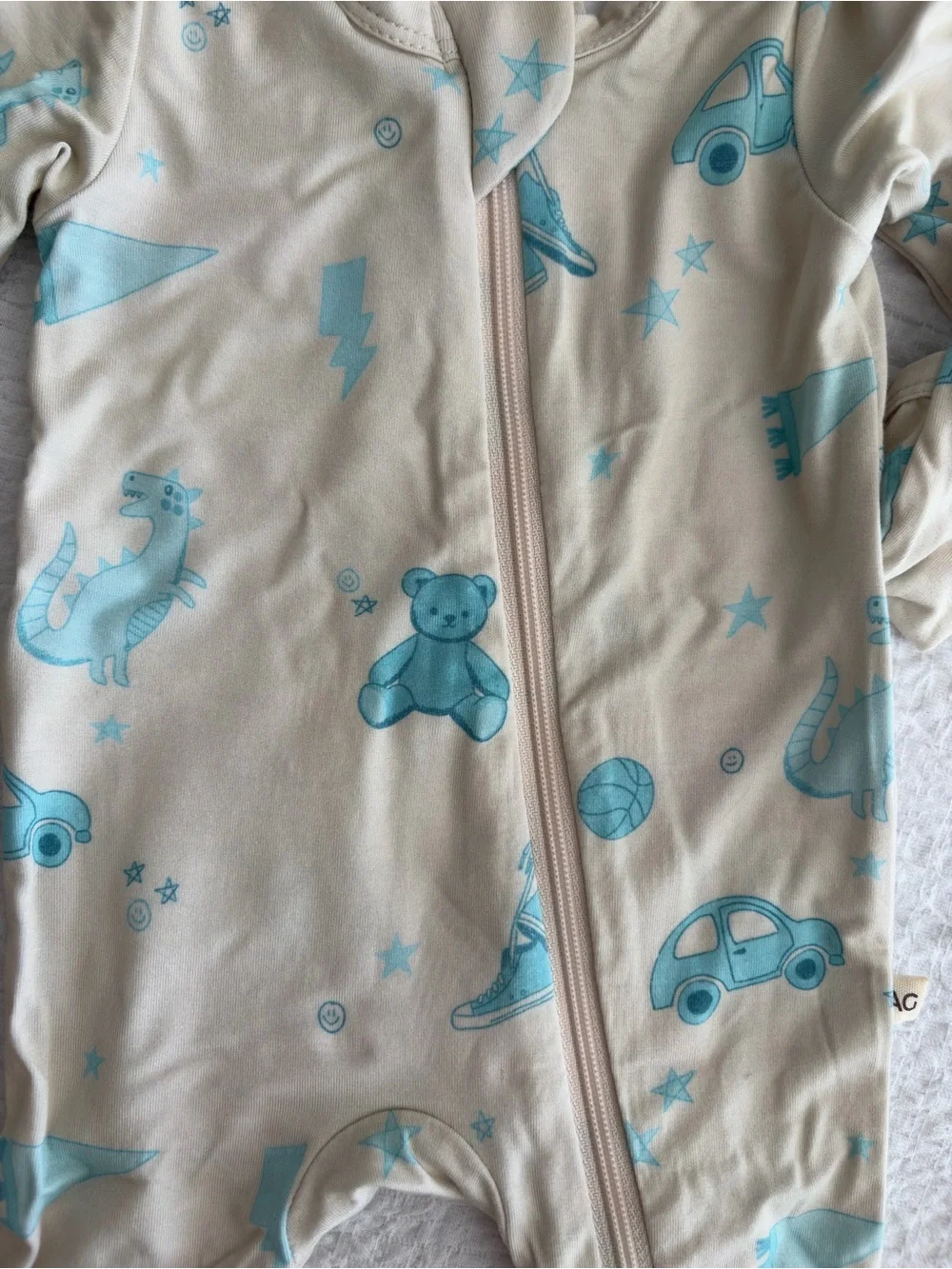 Cream Footed One-Piece with Light Blue Toy & Vehicle Motif